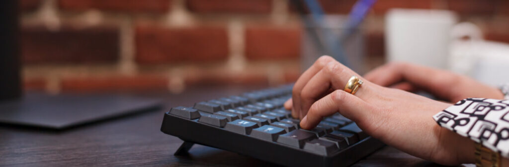 close-up-of-advertising-agency-employee-hands-typi-2022-03-08-15-25-58-utc-1024x337